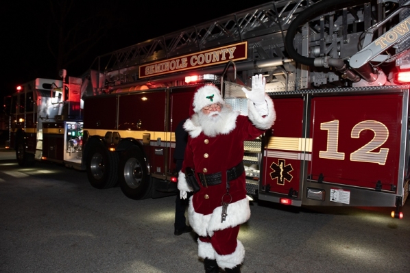 Santa Bobby arriving to the even on a firetruck - Seminole County